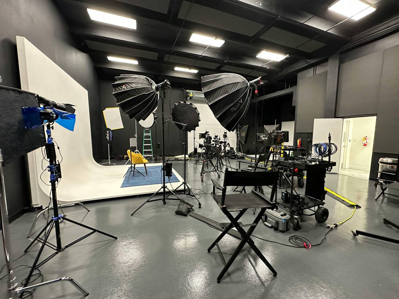Our main studio with a white cyclorama, lighting and cinema cameras